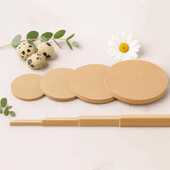 Set of round wooden coasters with a wooden holder on a light background with decorative elements.
