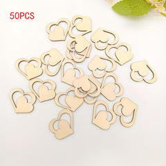 50 wooden heart-shaped objects on a white background with green leaves.