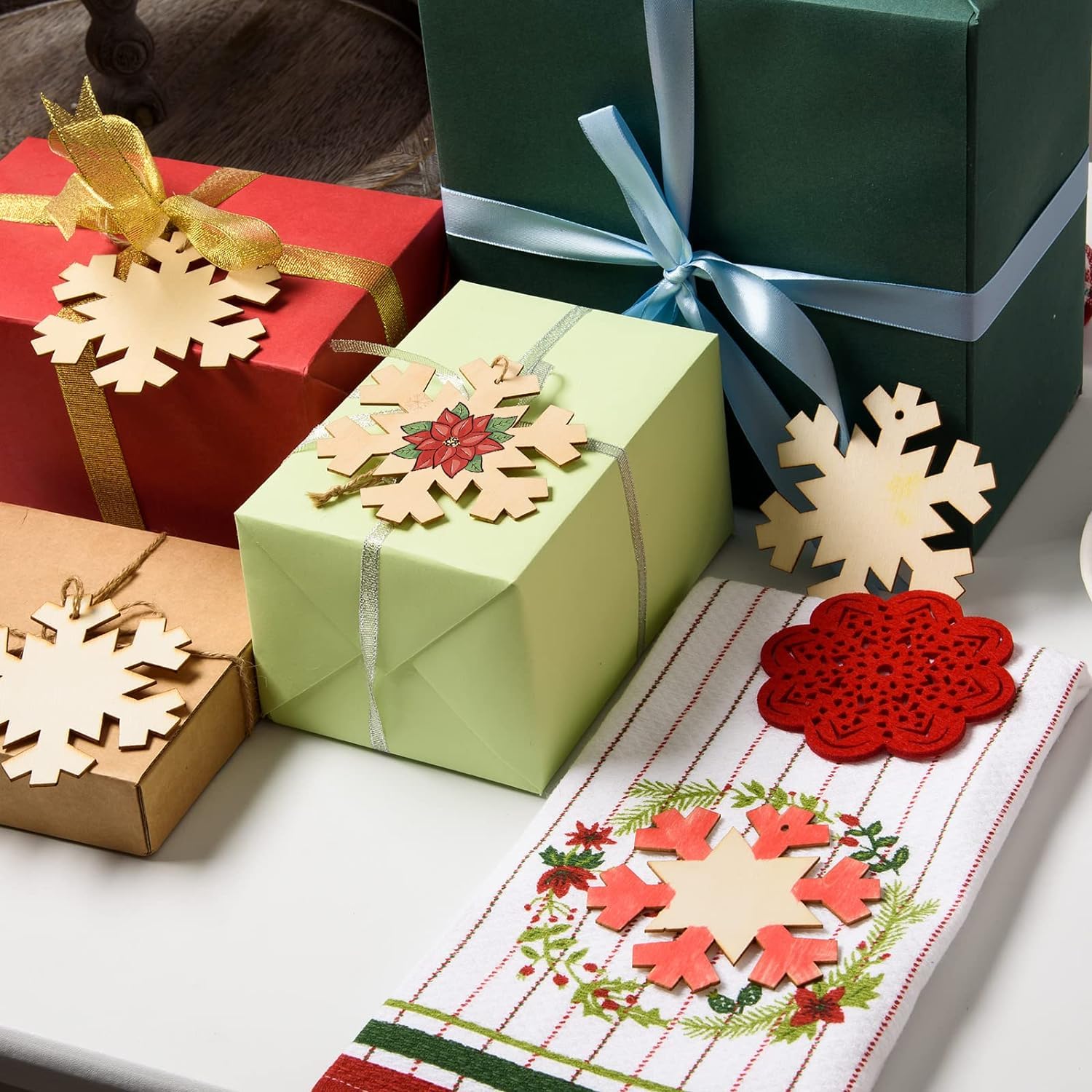 Gift boxes with decorative snowflakes on a table