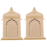 Two beige decorative wall pieces with intricate designs on a white background