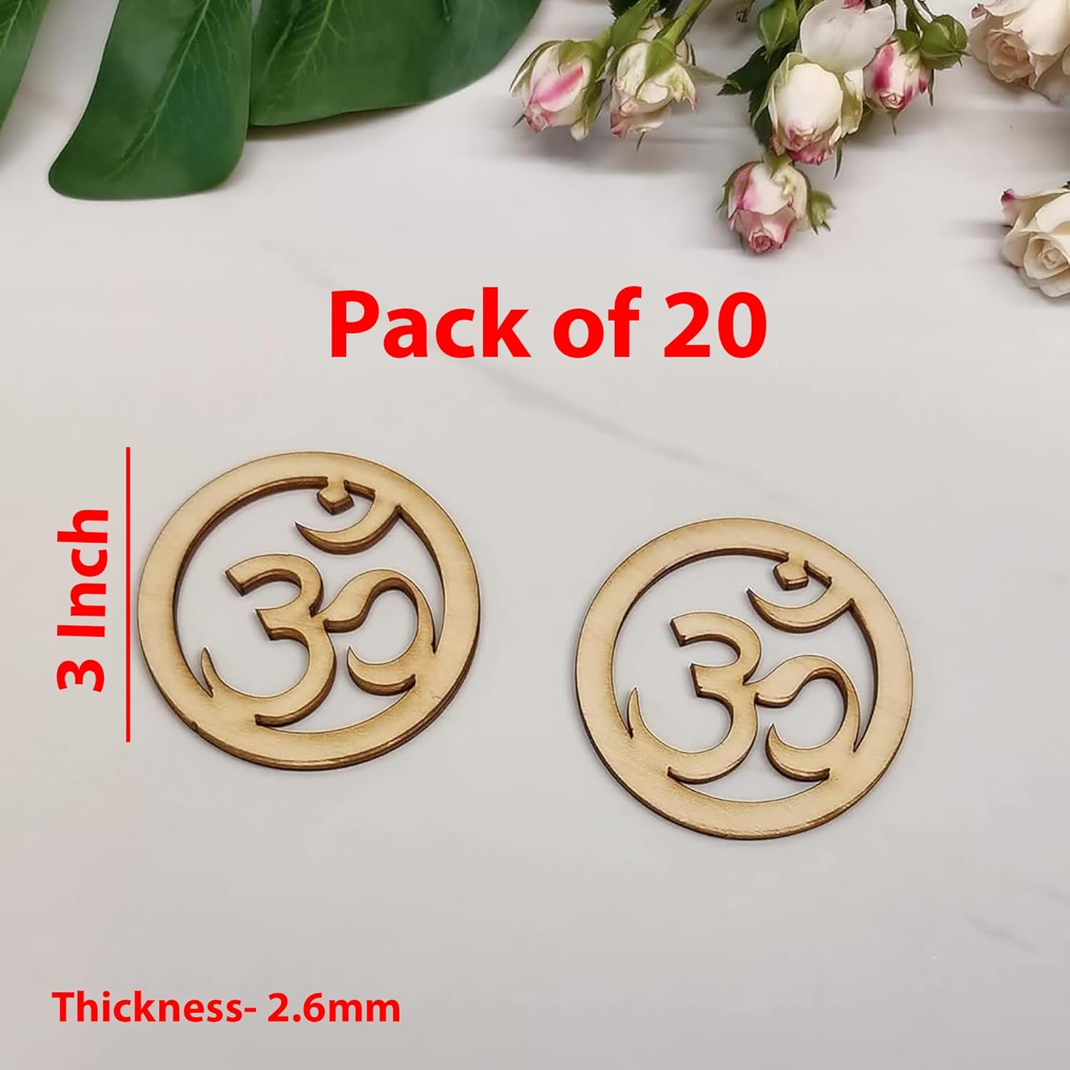 Two wooden 'Om' symbol decorations with measurement details on a light background.