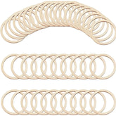Multiple wooden rings arranged in a curved pattern on a white background