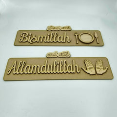 Two wooden plaques with engraved text and symbols on a white background