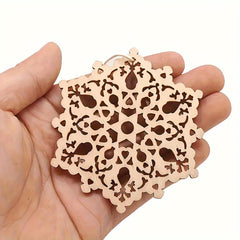 Decorative wooden cutout held in a hand against a white background