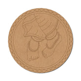 Round cardboard cutout of a foot with jewelry on a white background