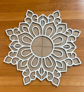Decorative wall art with intricate patterns on a wooden floor
