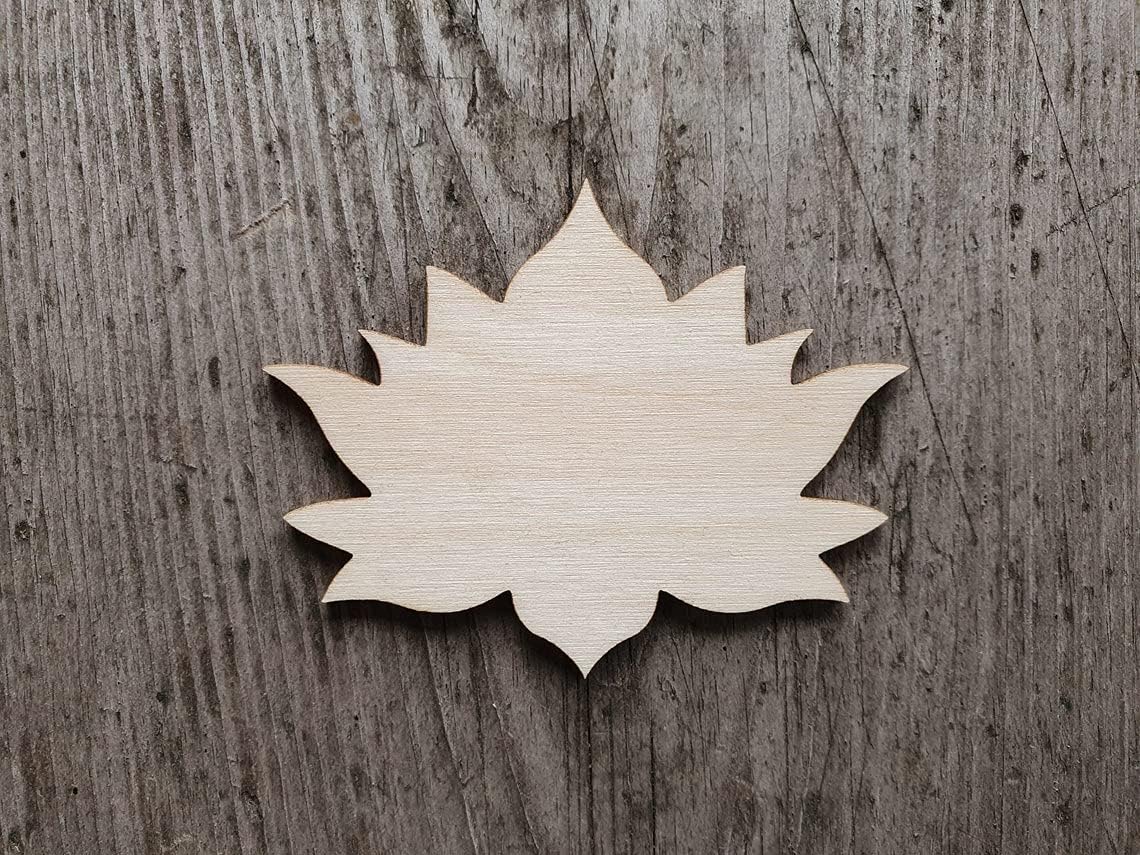 Wooden leaf-shaped cutout on a wooden surface