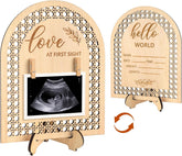Wooden photo frame with cut-out design, ultrasound image, and 'hello world' card.