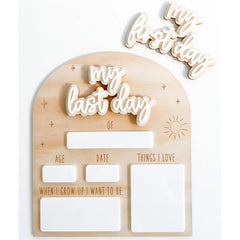 Wooden plaque with cut-out letters spelling 'my last day' and additional text fields on a white background.