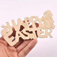 Wooden 'Happy Easter' decoration held in a hand against a light pink background