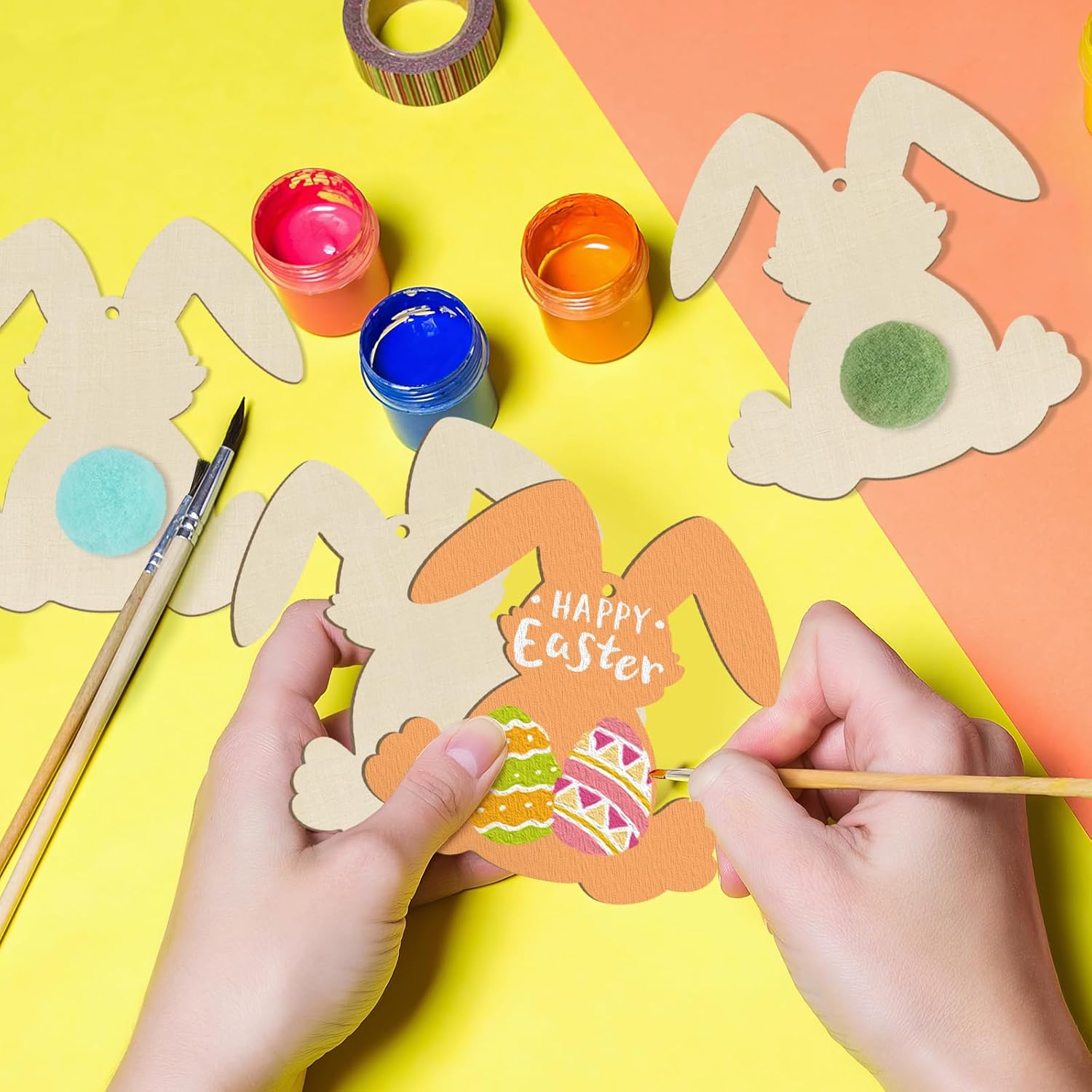 Children painting Easter bunny cutouts on a colorful background