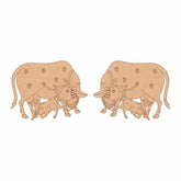 Wooden cutout of a bull and calf design on a white background