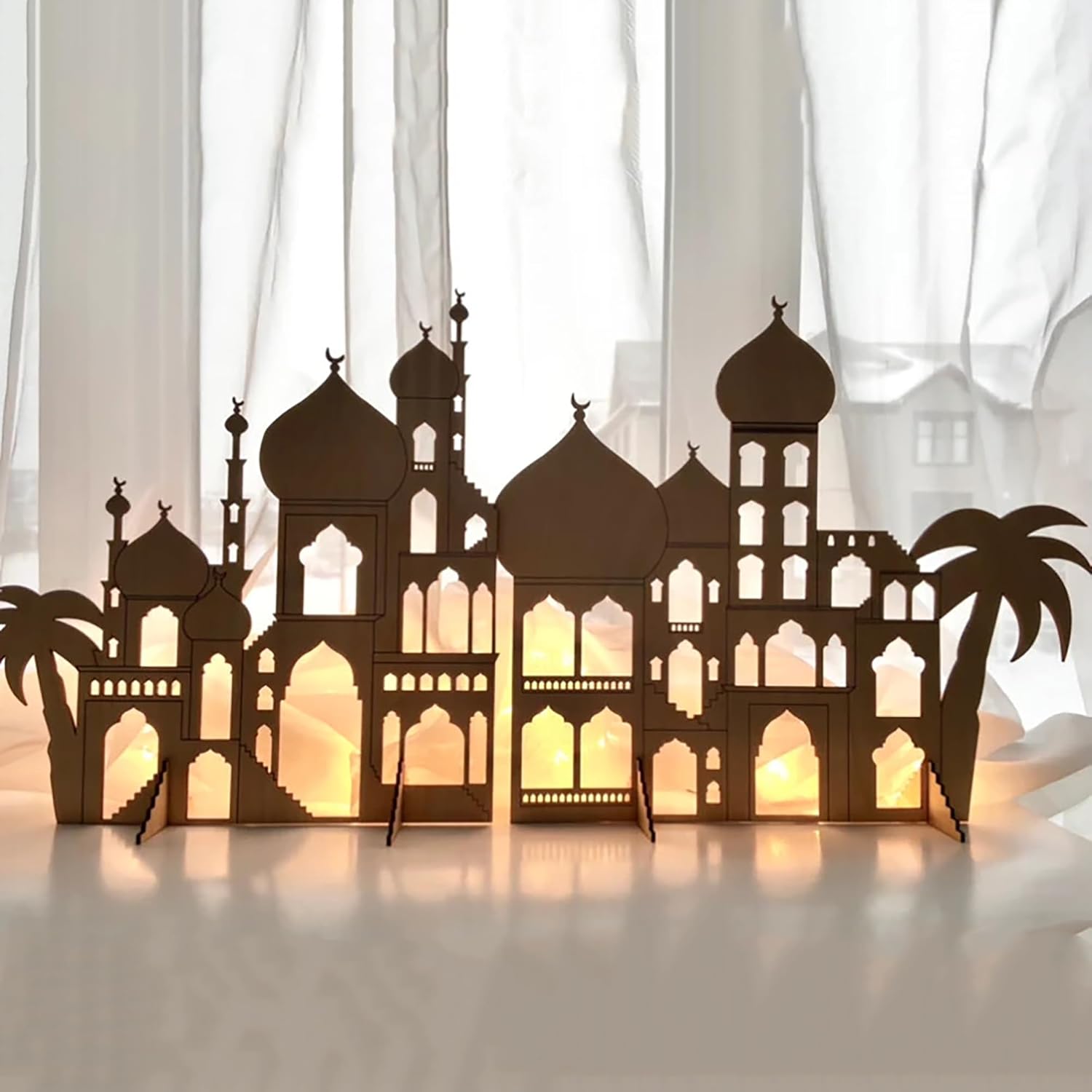 Decorative cityscape with illuminated windows on a white background