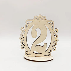 Wooden number '2' with decorative frame on a white background