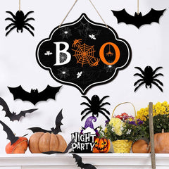 Halloween-themed decoration with 'BOO' sign, pumpkins, and flowers on a white background.
