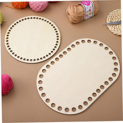 Two wooden lace knitting boards with yarn on a brown surface