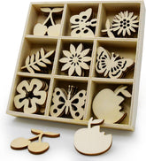 Set of wooden cutouts including flowers, butterflies, and cherries in a box on a white background