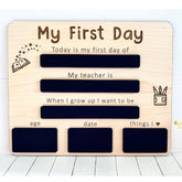 Wooden plaque with engraved text for 'My First Day' of school, including fields for teacher's name, date, age, and aspirations.