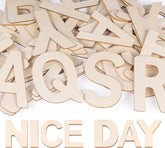 Wooden letters spelling 'NICE DAY' on a white background