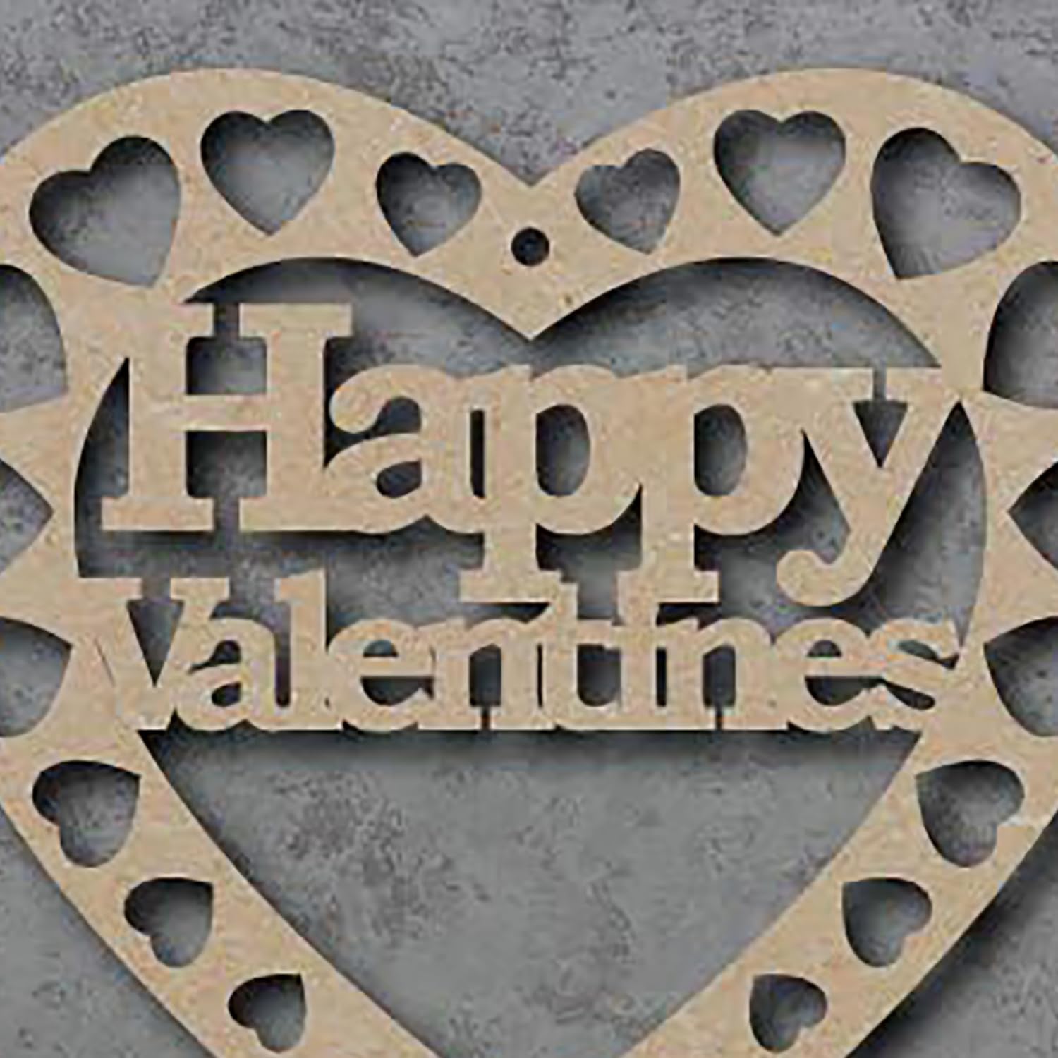 Heart-shaped wooden cutout with 'Happy Valentine's' text on a gray background