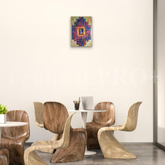 Dining room with wooden chairs and a colorful abstract painting on the wall.