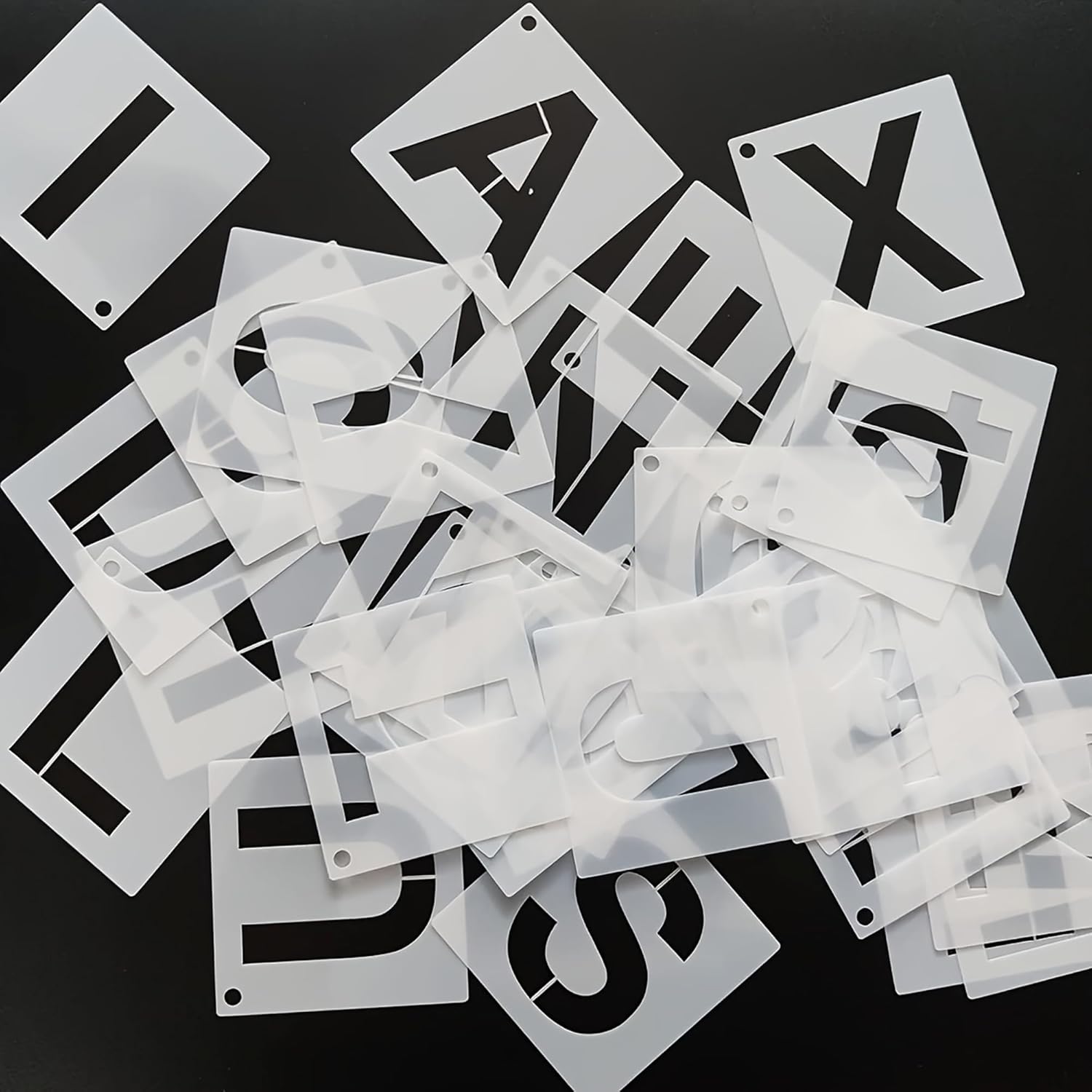 Set of letter stencils on a black background