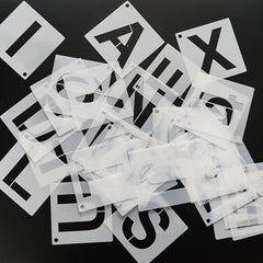 Set of letter stencils on a black background