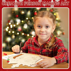 Child in a red plaid shirt coloring a picture of a reindeer in front of a decorated Christmas tree.