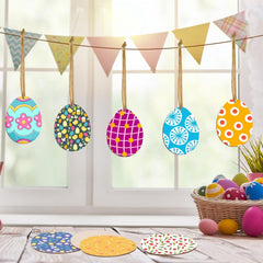 Colorful Easter egg decorations hanging on a line with a basket of eggs and bunting in the background.