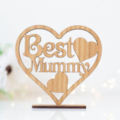 Wooden heart-shaped sign with 'Best Mummy' text on a white background