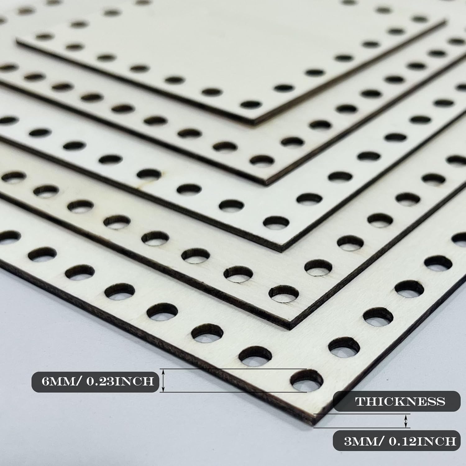 Sheet of perforated material with measurement labels on a light gray background