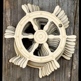 Wooden decorative propeller on a wooden background