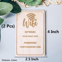 Wooden plaque with engraved text for WiFi network name and password on a light blue background.