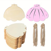Set of shell-shaped wooden tags with pink and beige colors, and strings for hanging on a white background.