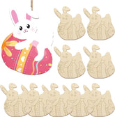 Set of wooden Easter decorations with bunny and egg designs on a white background