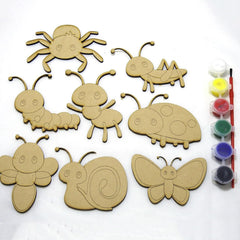 Set of insect-shaped wooden craft pieces with paint bottles and brushes on a white background