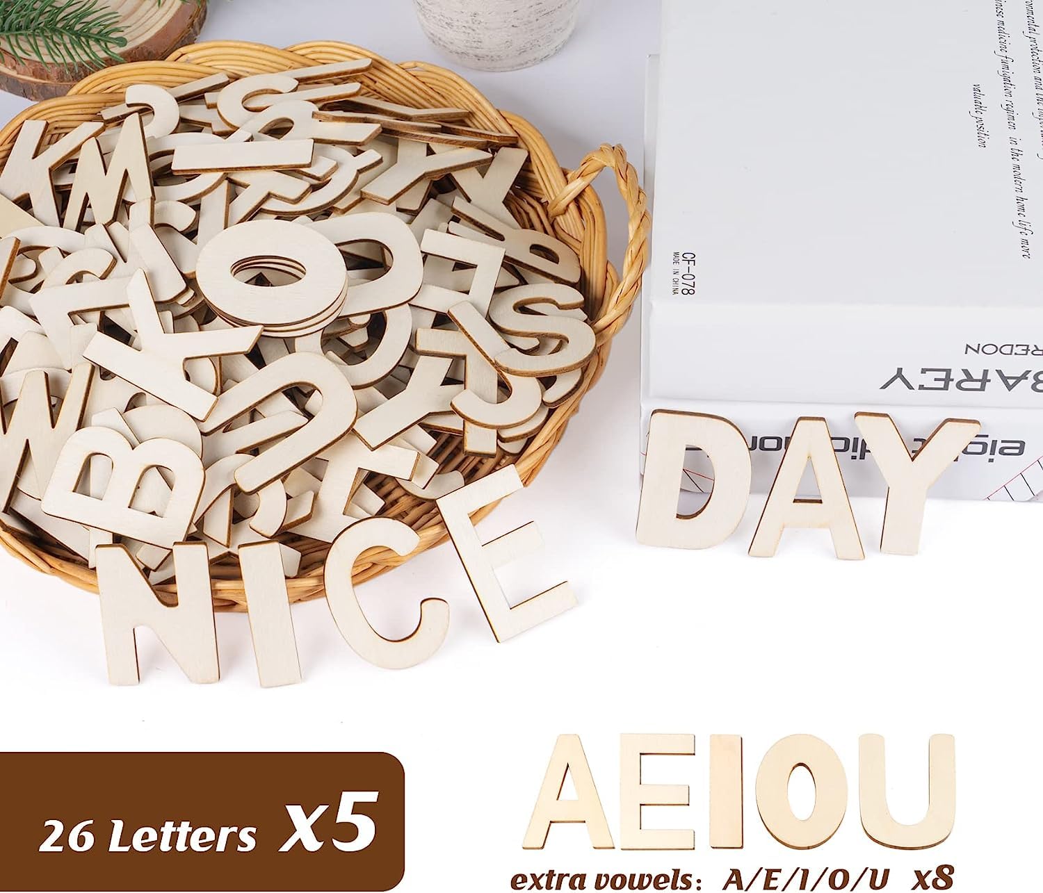 Wooden letters in a basket with 'NICE DAY' and 'AEIOU' displayed, on a white background.