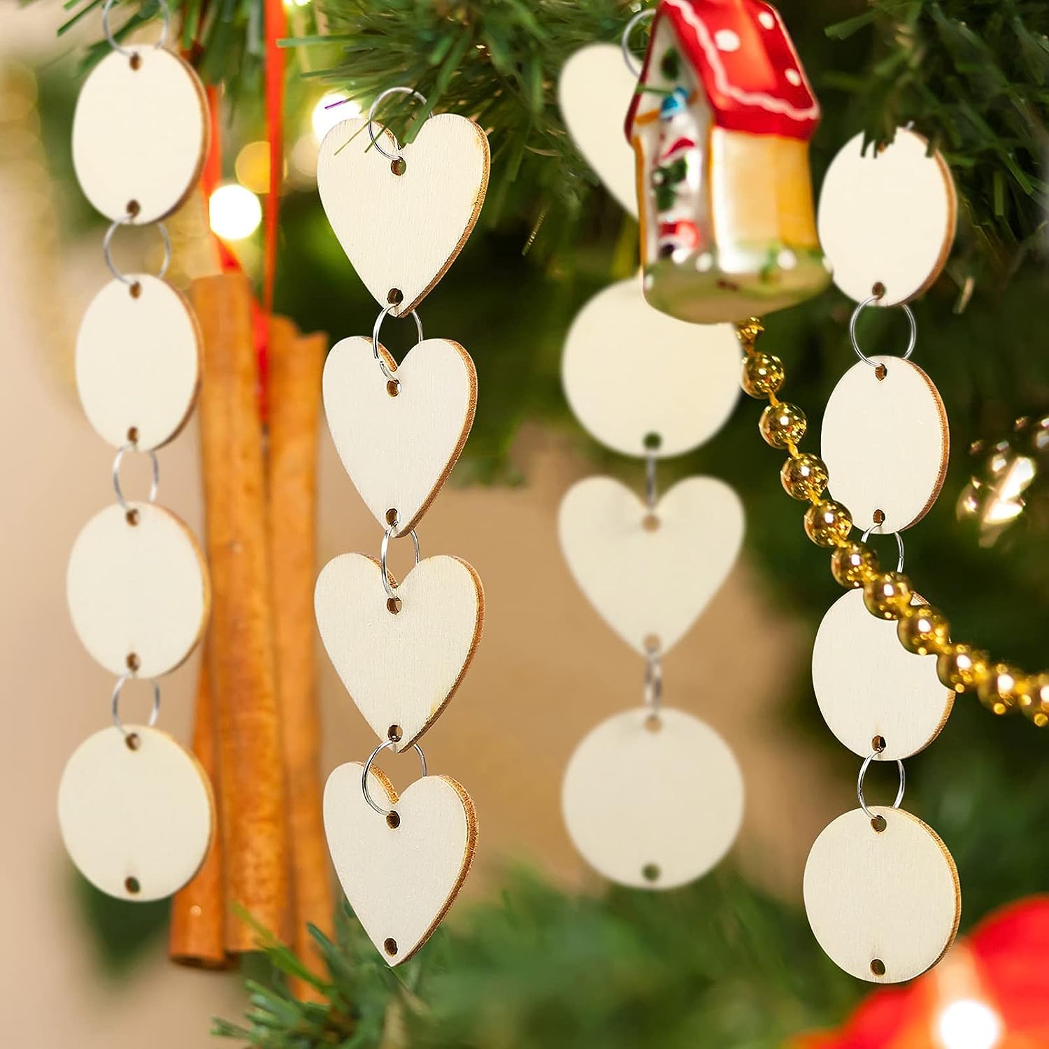 Decorative heart-shaped ornaments hanging on a Christmas tree.