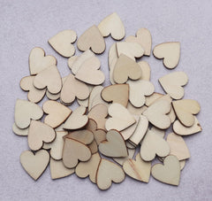 Collection of wooden heart shapes on a light gray background