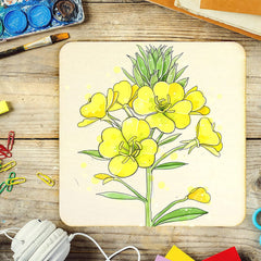 Colorful drawing of a floral design on a wooden surface with art supplies.