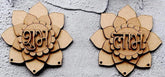 Two wooden lotus-shaped decorations with engraved text on a textured gray surface