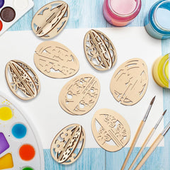 Wooden stencils with intricate designs on a table with paint and brushes