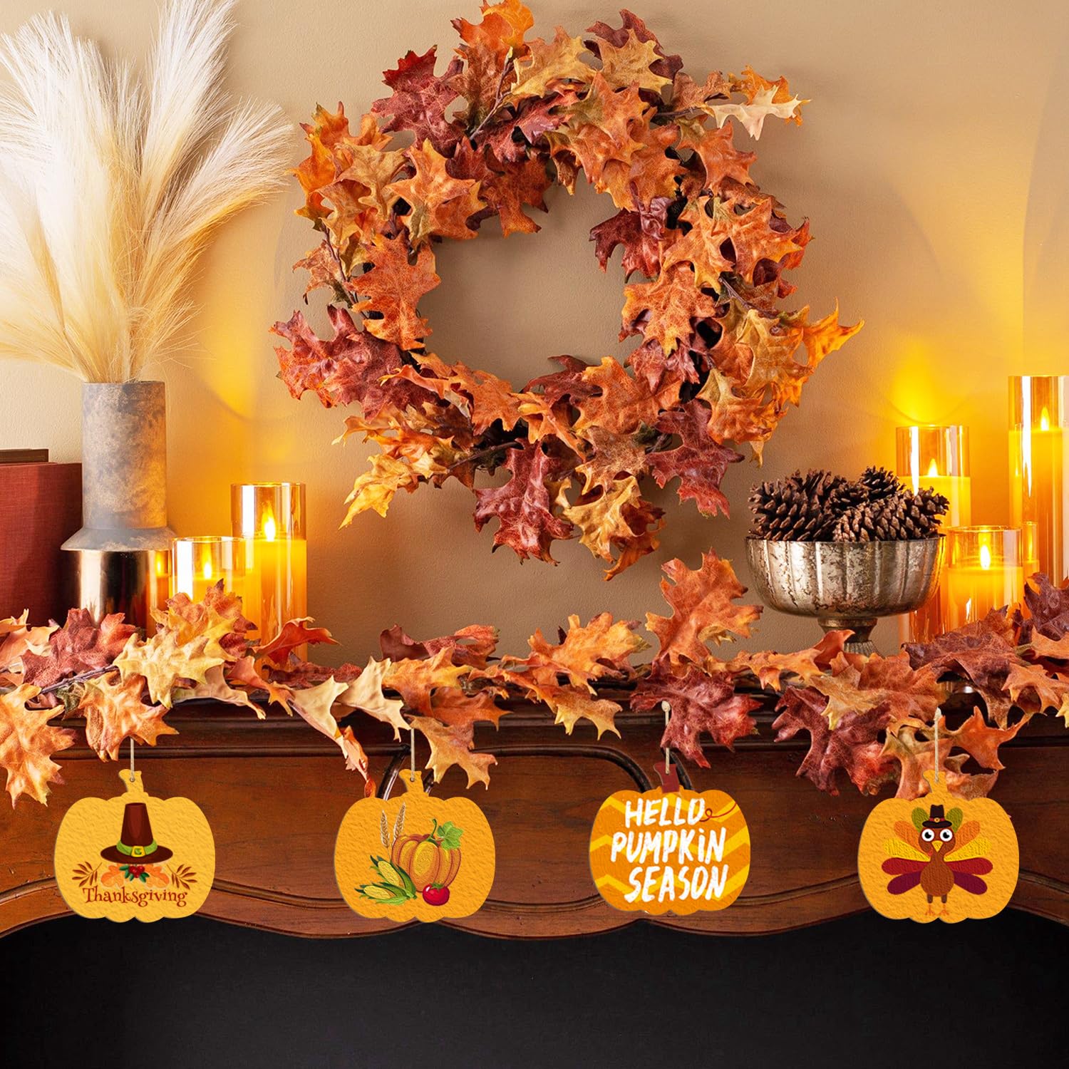 Decorative Thanksgiving mantel with leaf wreath, garland, and autumn-themed signs.