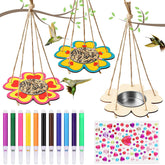 Colorful bird feeders hanging from a branch with small birds, markers, and stickers.