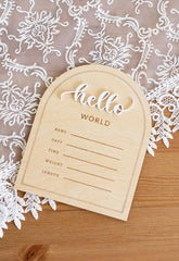 Wooden baby登记表 with 'hello world' text on a lace background
