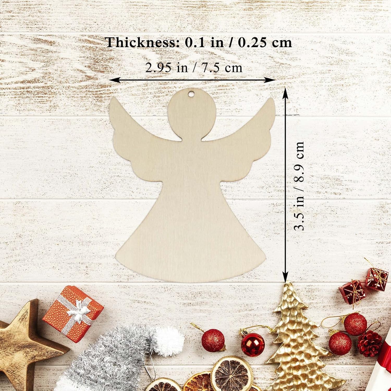 Measurement chart of a angel-shaped wooden ornament with Christmas decorations on a wooden background