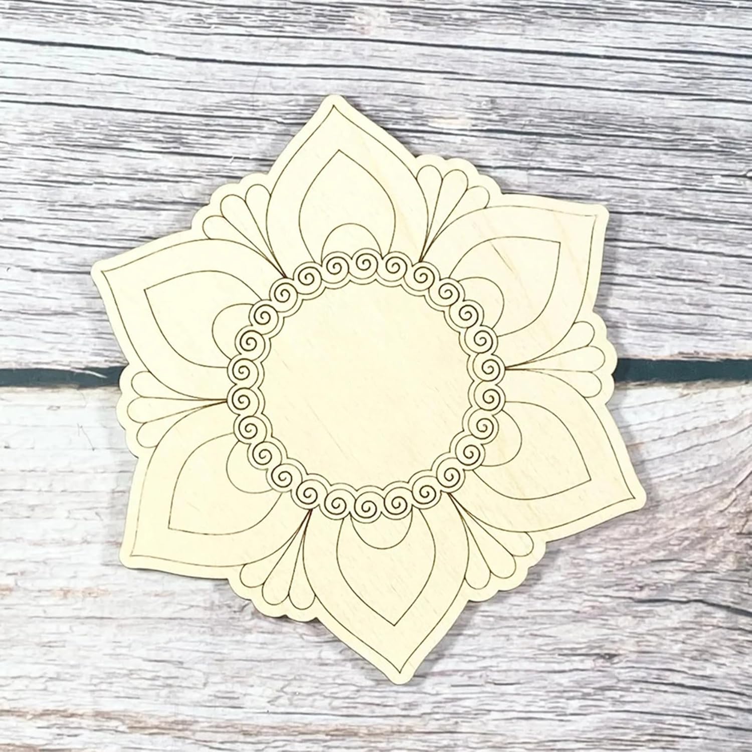 Decorative headband with a floral design on a wooden surface