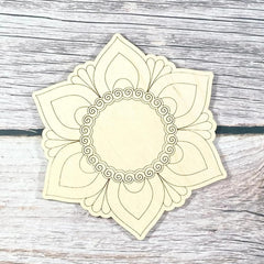 Decorative headband with a floral design on a wooden surface