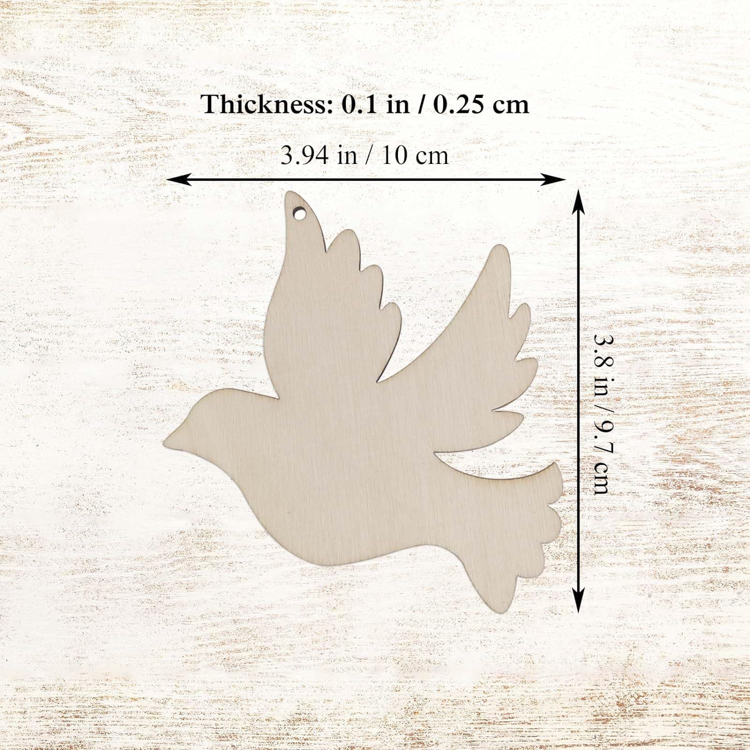 Wooden dove shape with measurements on a wooden background