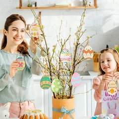 Woman and child holding Easter-themed decorations in a kitchen setting